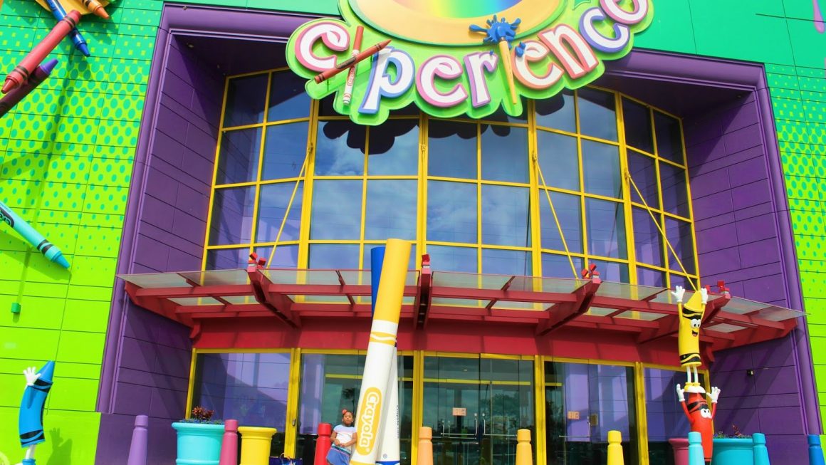 Child standing In front of Crayola Experience in Orlando