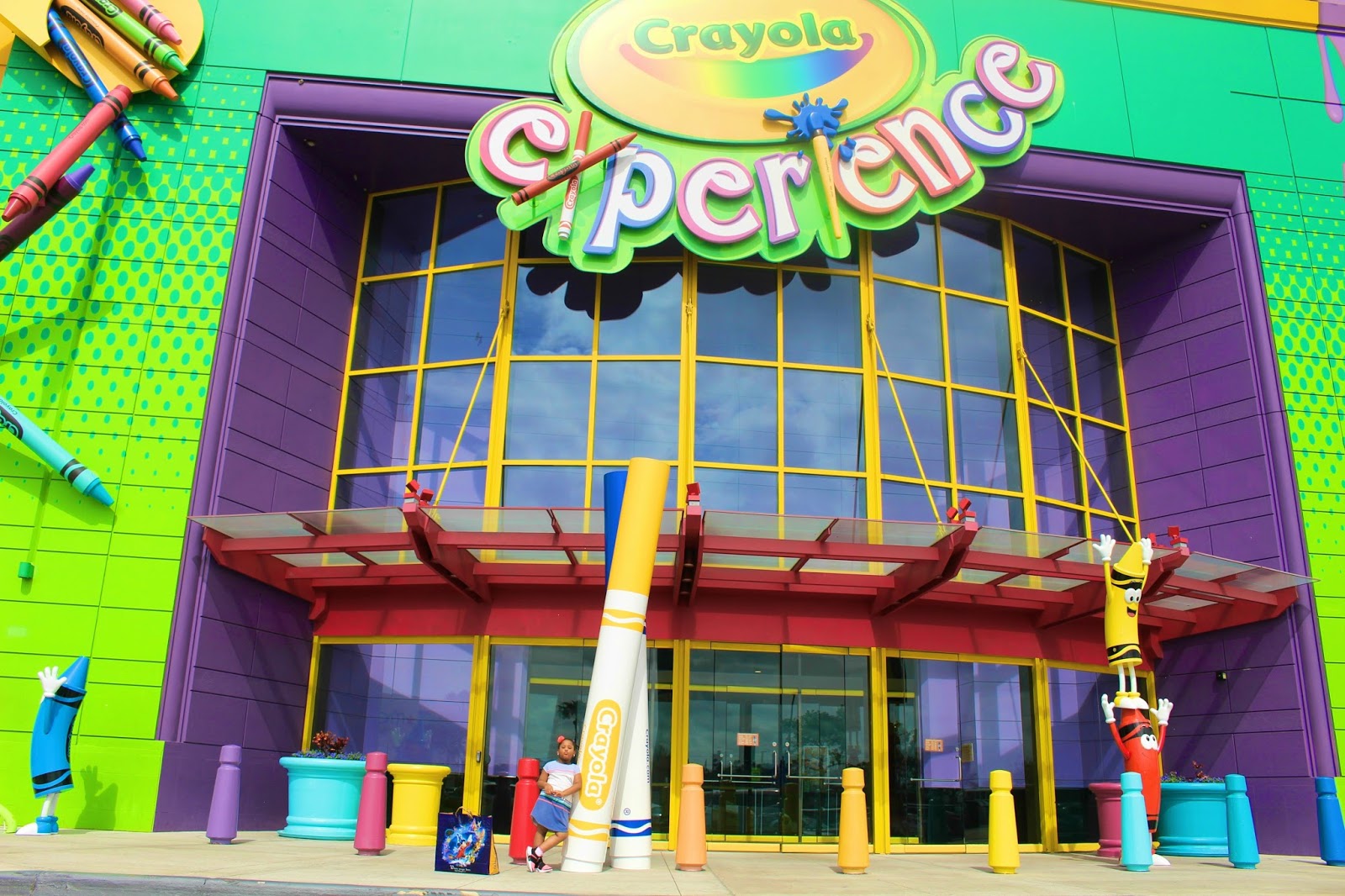Child standing In front of Crayola Experience in Orlando
